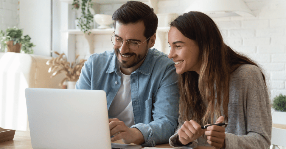 graphic of a couple viewing media on a laptop